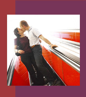 Couple kissing on escalator - Relationship Counseling L.A.